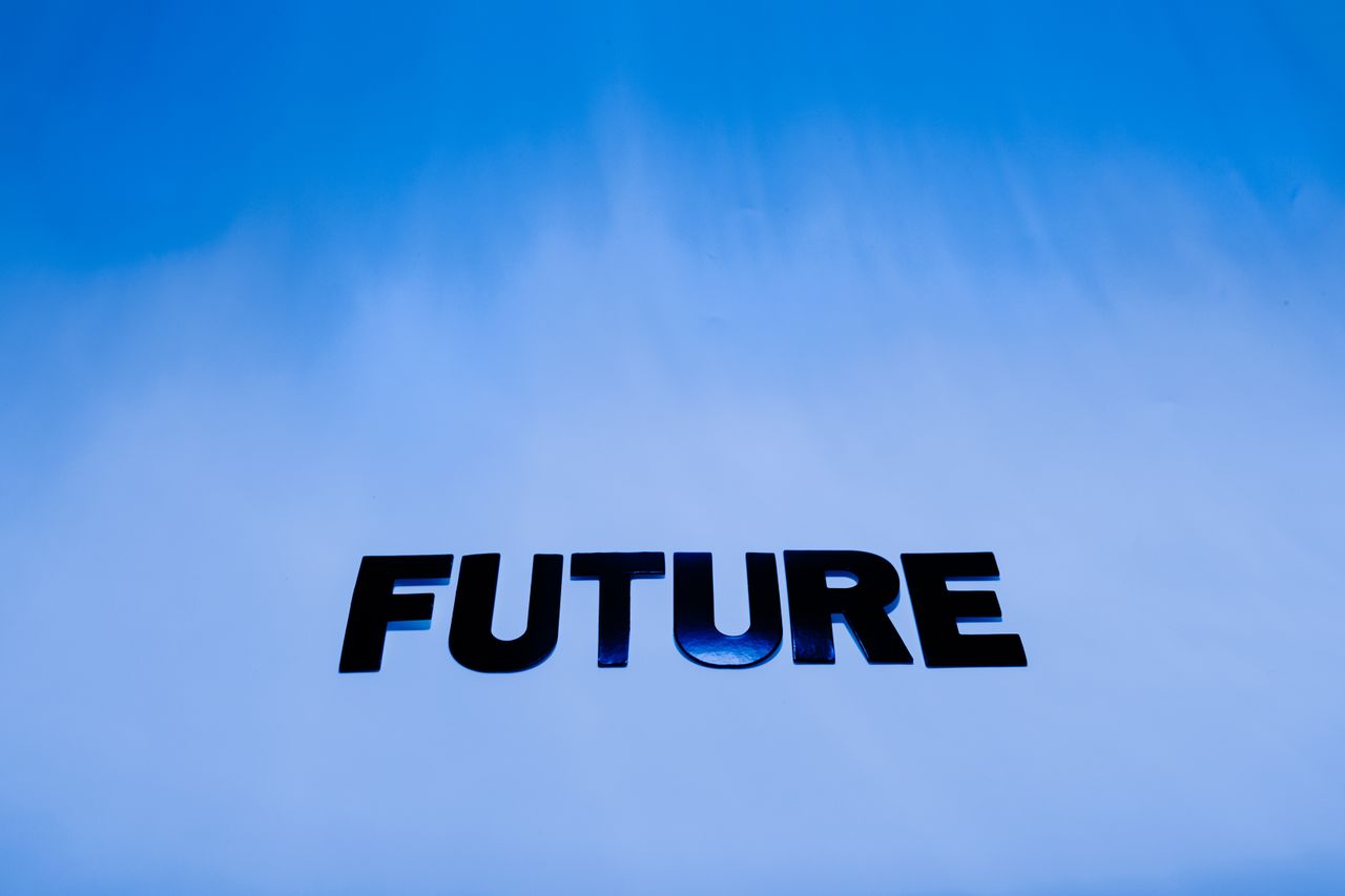 The word Future in bold letters against a bright blue abstract background.